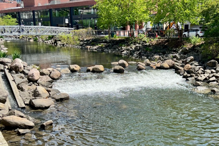 a body of water with a city in the background