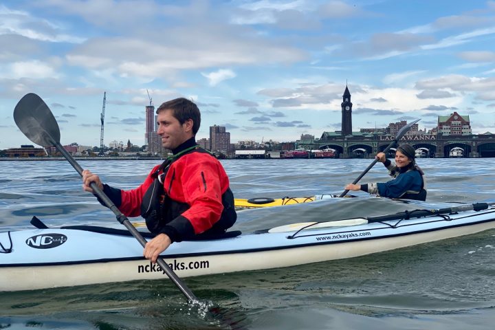 a person riding a surf board on a body of water