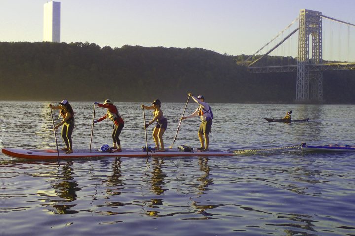 paddle boarders near the George Washington Bridge