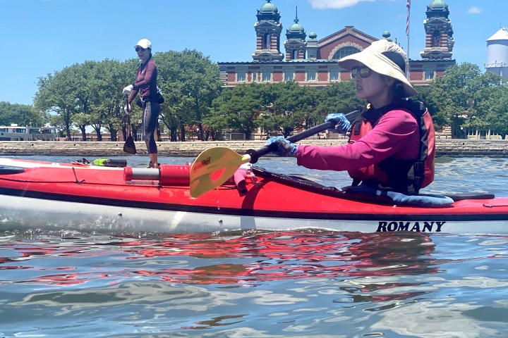 women kayaking and SUPing near the Lackawanna Railroad Terminal