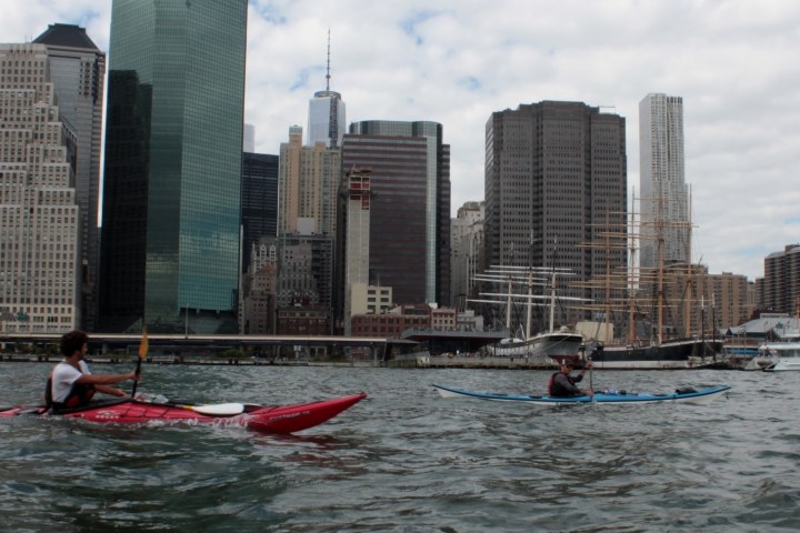 a group of people in a boat on a body of water