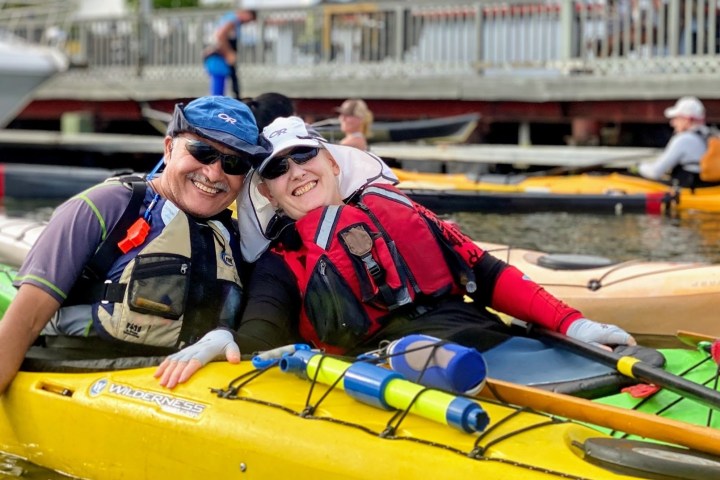 a couple riding in kayaks