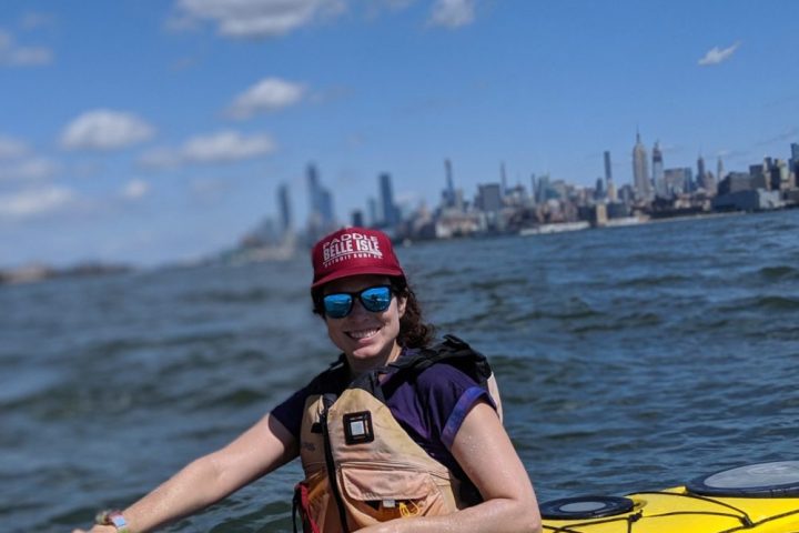 a woman in a yellow kayak in NYC
