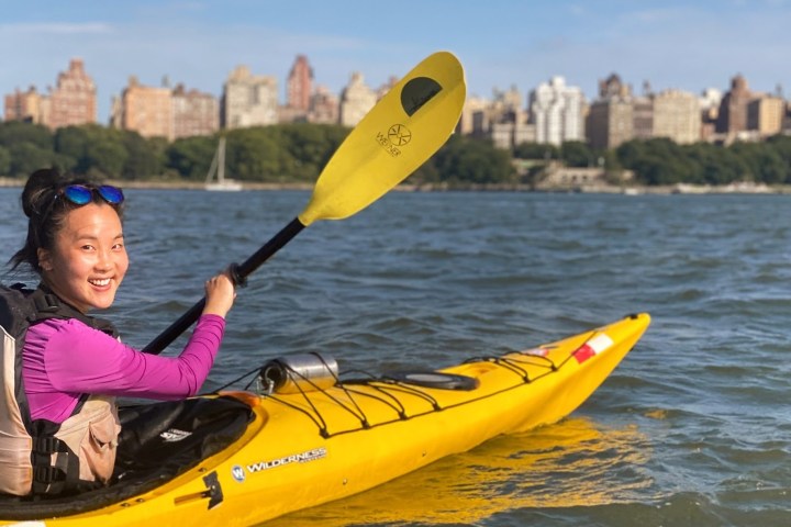 a person riding a surf board on a body of water