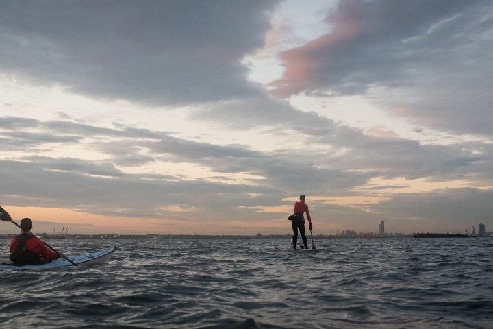a man riding a surfboard in the water