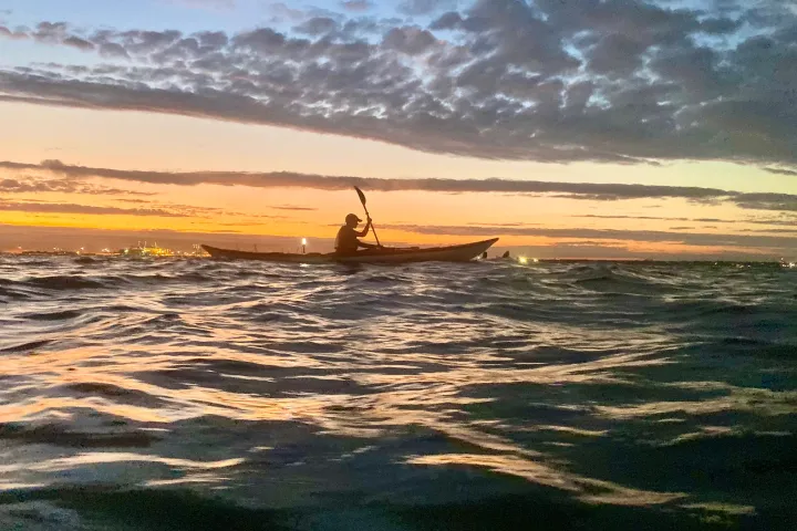 a sunset over a body of water