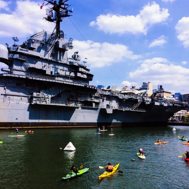 The best view of the USS Intrepid Sea, Air & Space Museum from a kayak in the calm Pier 84 cove.