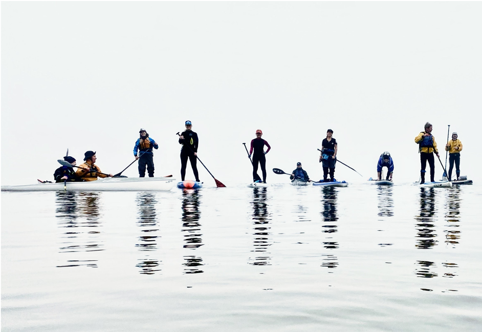 winter kayaking kayakers and paddleboarders in the winter