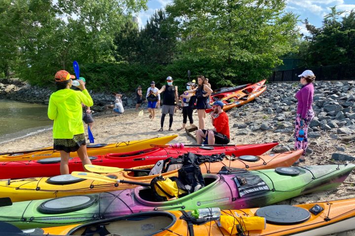 a group of people at a NYC beach