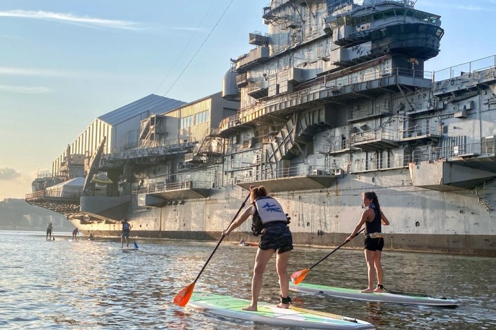 two women on stand up paddle boards