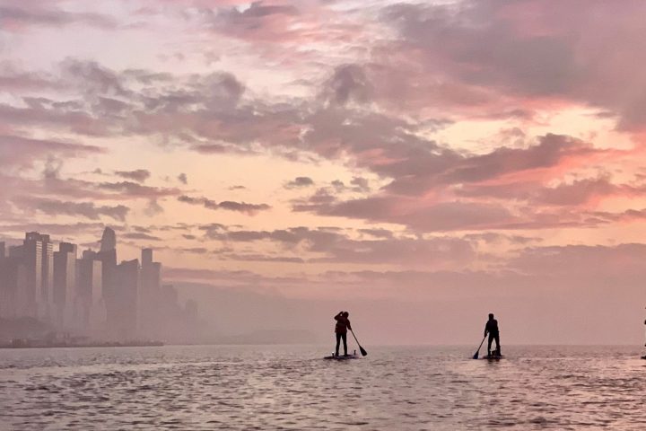 a group of people walking around in the ocean