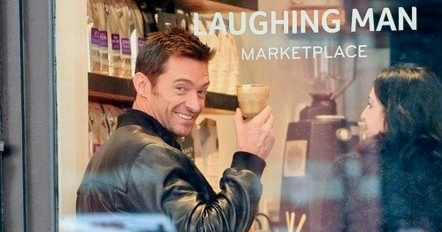 Hugh Jackman holding a glass