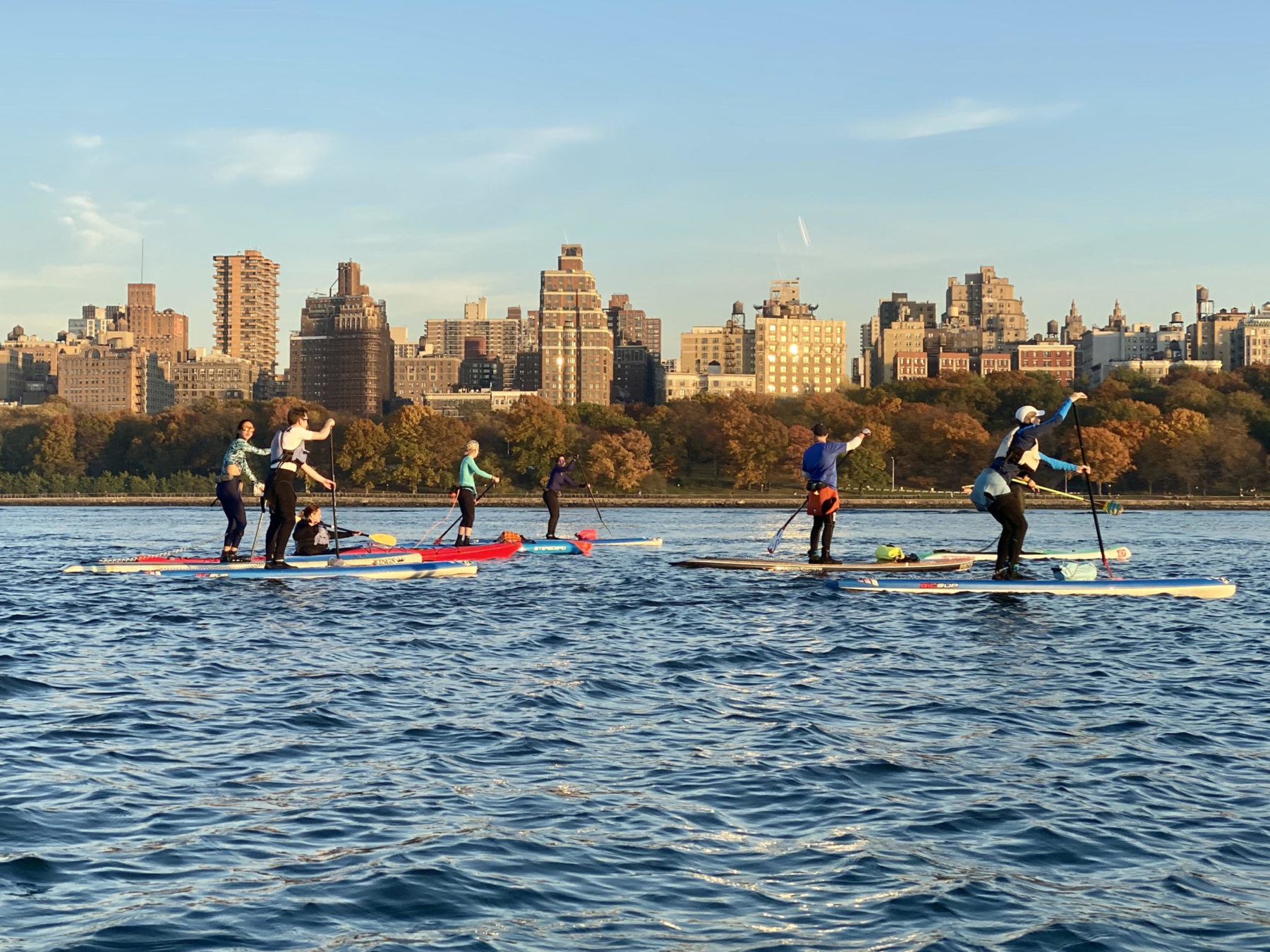 SUP trip a group of people paddle boarding in NYC