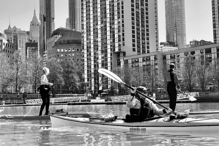 a man that is standing in the rain