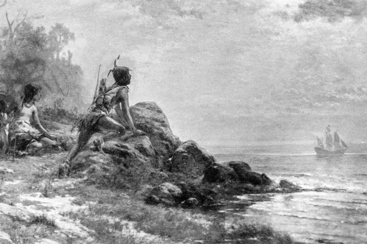 a man riding a horse in a body of water