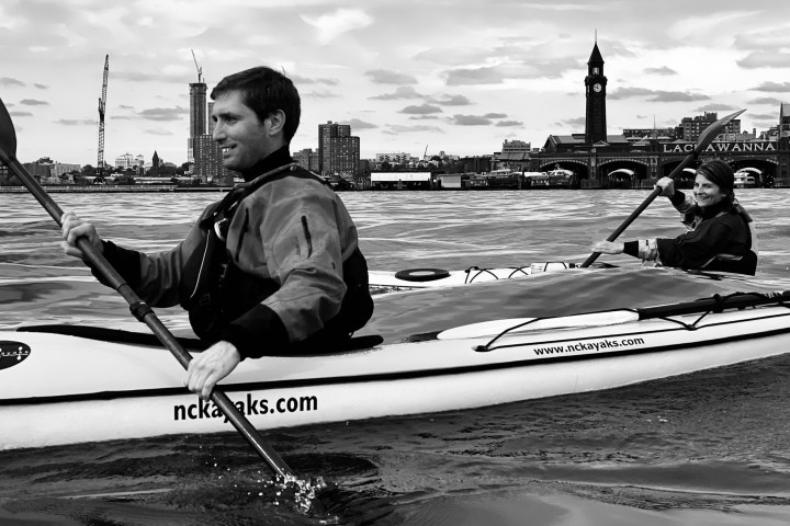 a person rowing a boat in the water