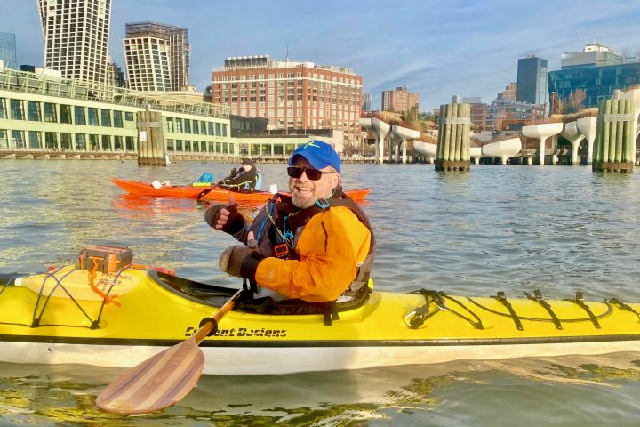 a man riding a kayak in Manhattan