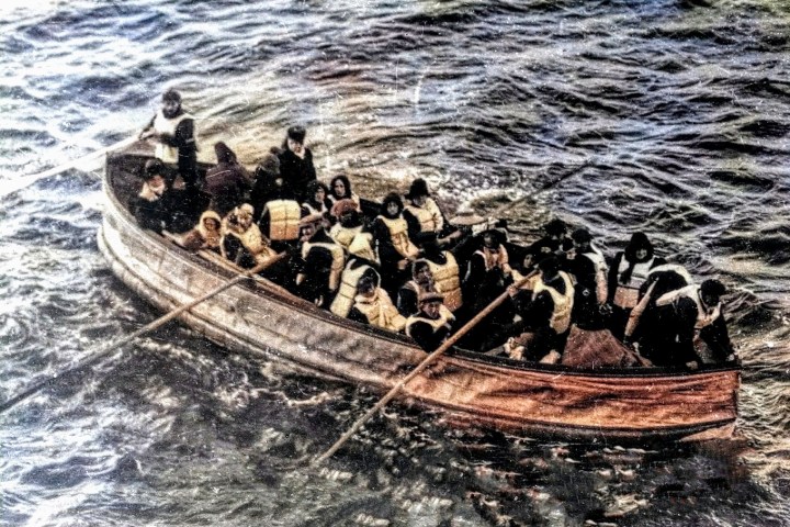 a group of people on a raft in a body of water