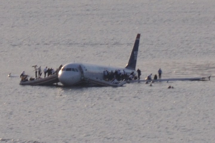a airplane that is parked next to a body of water