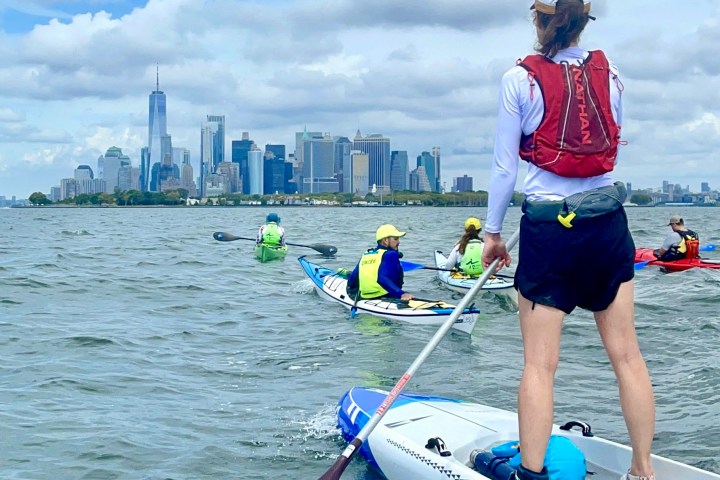 a person riding a surf board on a body of water