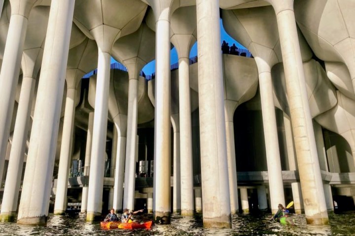 two men kayaking under Little Island in NYC