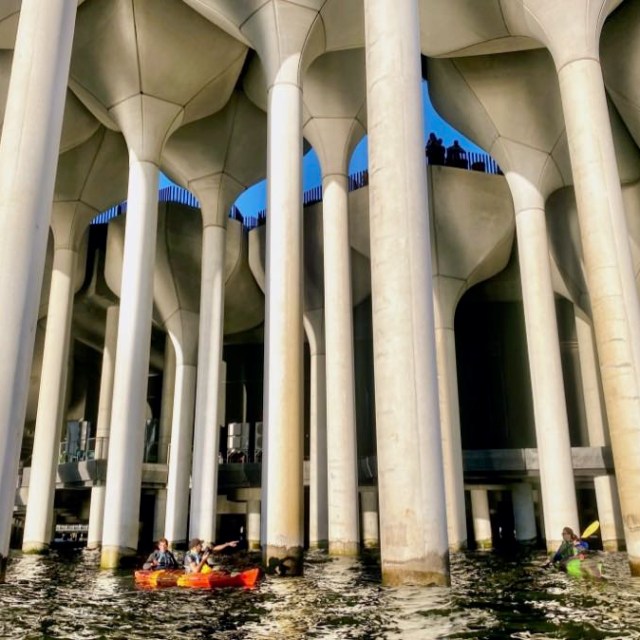 two men kayaking under Little Island in NYC