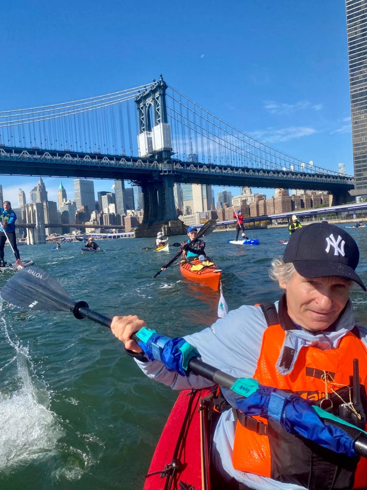 a group of people on a boat in the water