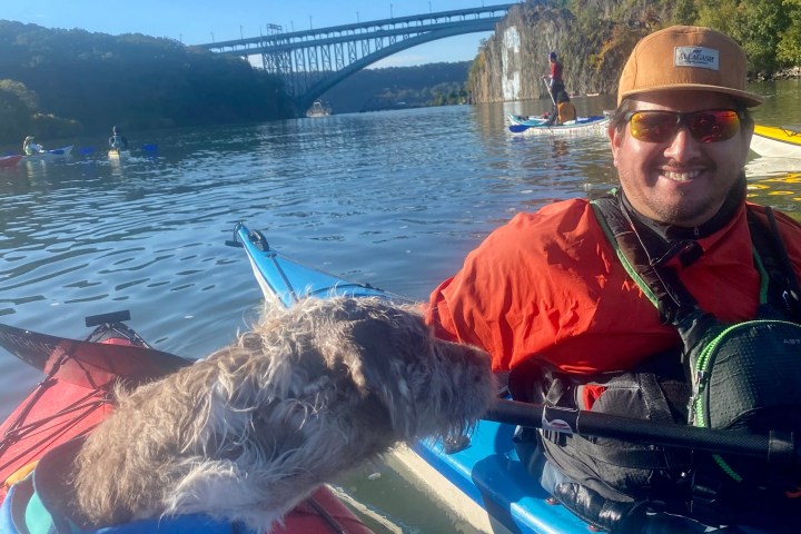 a man in a boat on a body of water