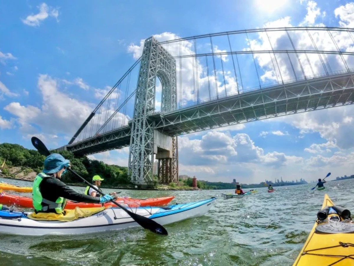 a person riding on the back of a boat