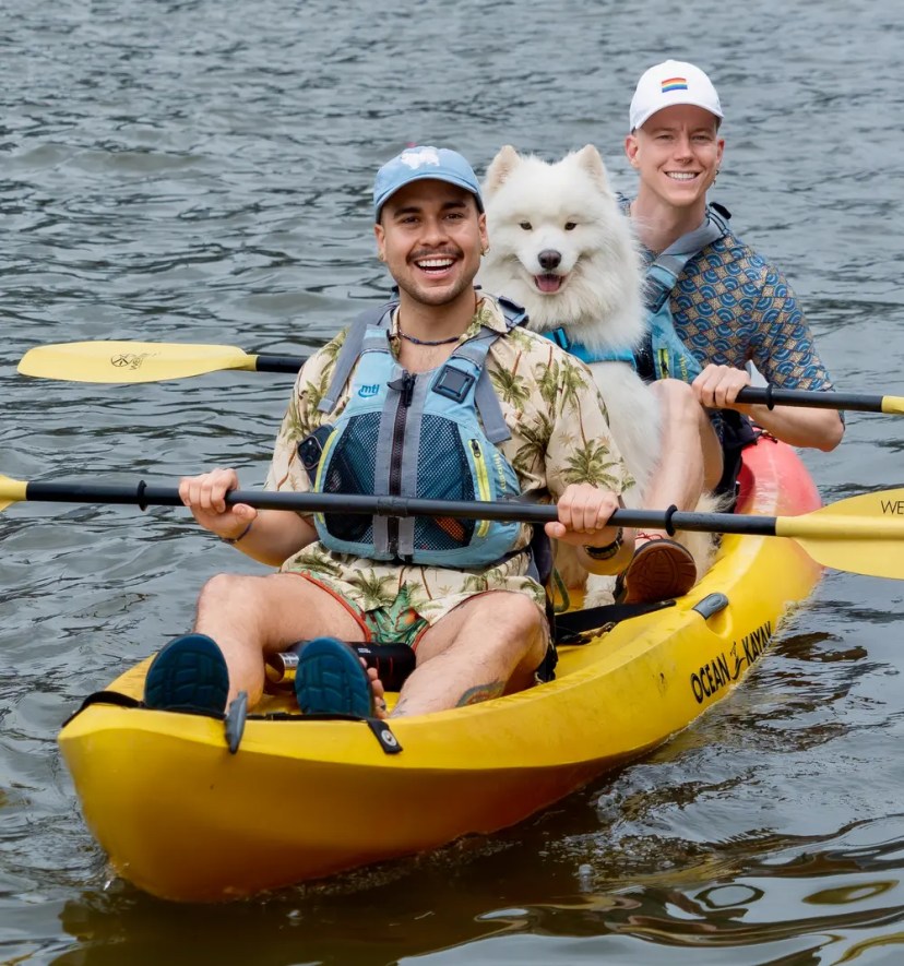 Dog-friendly kayaking at Manhattan Kayak Co, Pier 84. A Samoyed in a yellow rental kayak in the Intrepid Museum cove. Photo by Isma Vidal.