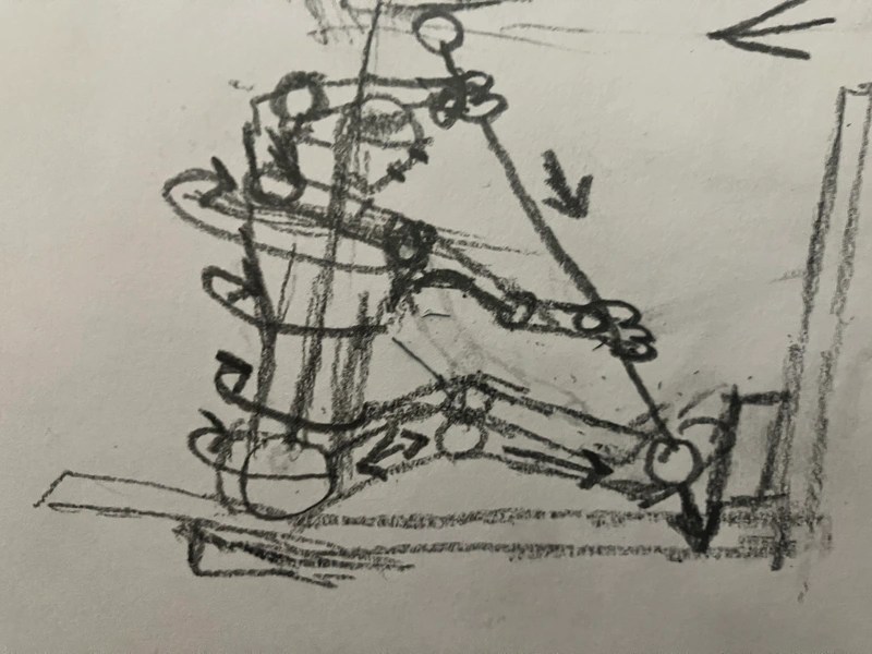 Sketch of a person using a rowing machine.